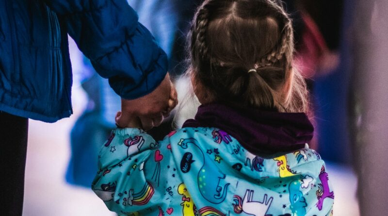 Little girl holding an adult's hand, reflecting the care foster carers give children